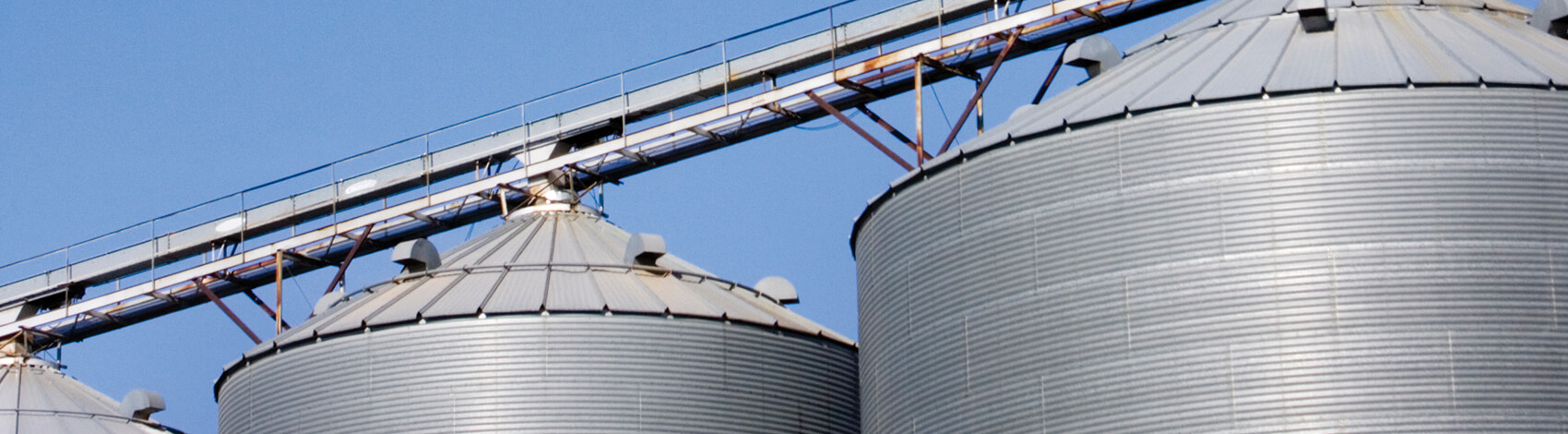 Agricultural silos painted with Jetcoat fibered aluminum roof coating